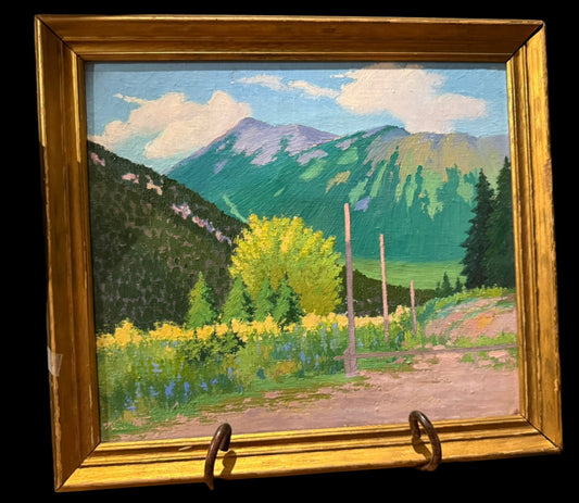 Framed painting of a mountain landscape with trees and a path.