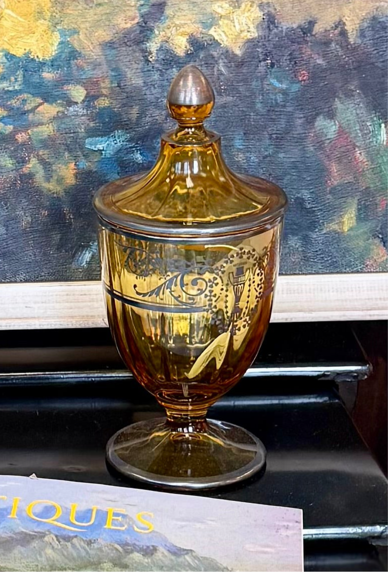 Amber glass covered jar with sterling silver overlay of leaf scross and urb design