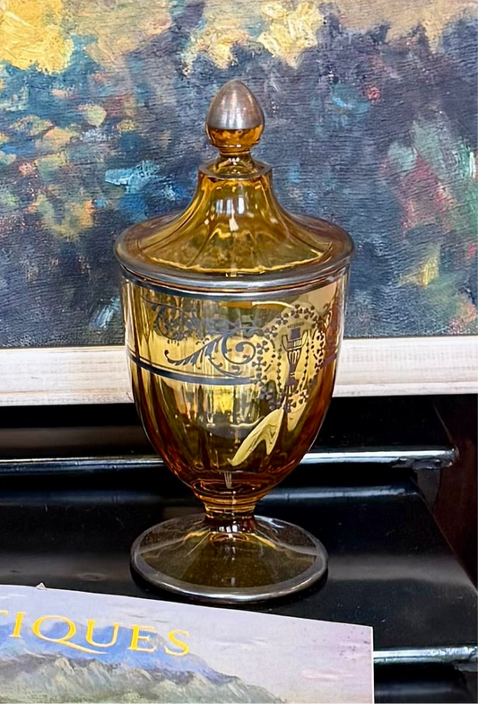 Amber glass covered jar with sterling silver overlay of leaf scross and urb design